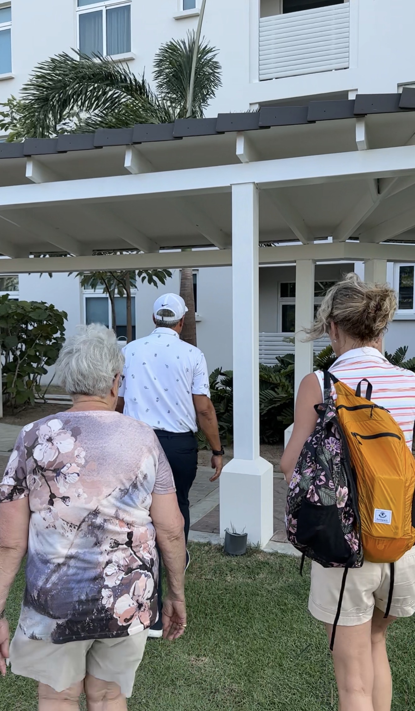 A scouting-visit moment walking a residential street with a client — the on-the-ground research no listing photos can replace